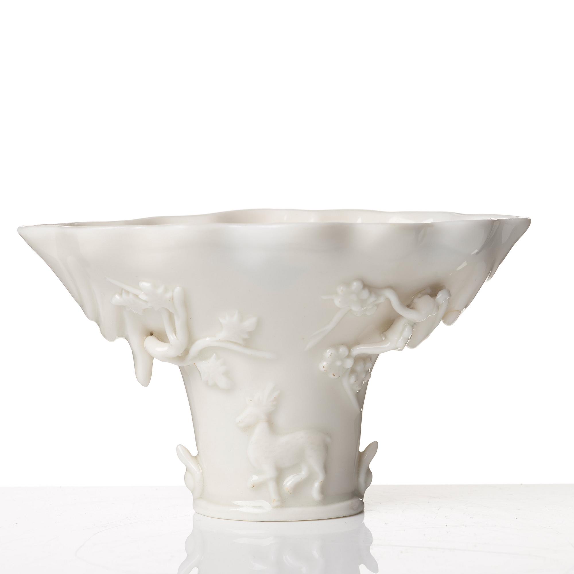 A blanc de chine rhinoserous libation cup, Qing dynasty, Kangxi (1662-1722).