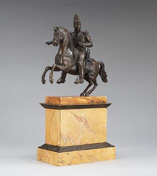 A French first half 19th century equestrian bronze and Sienna marble veneered statue.