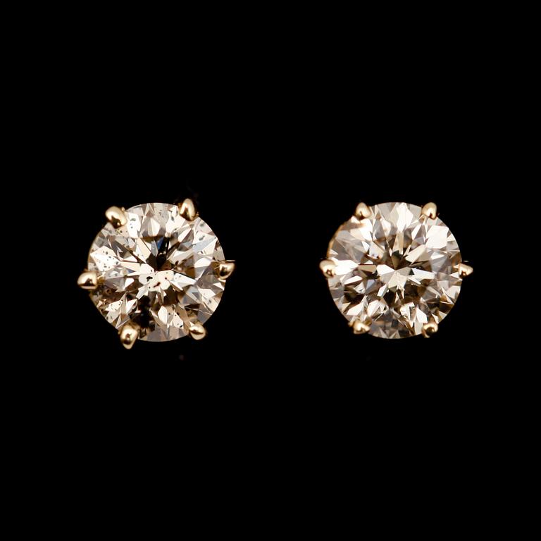 ÖRHÄNGEN, 1 par, 14 k guld, solitära briljantslipade diamanter totalt 0.84 ct.