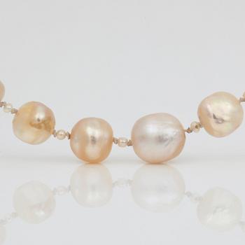 A possibly natural saltwater pearl necklace, clasp set with rose-cut diamonds.