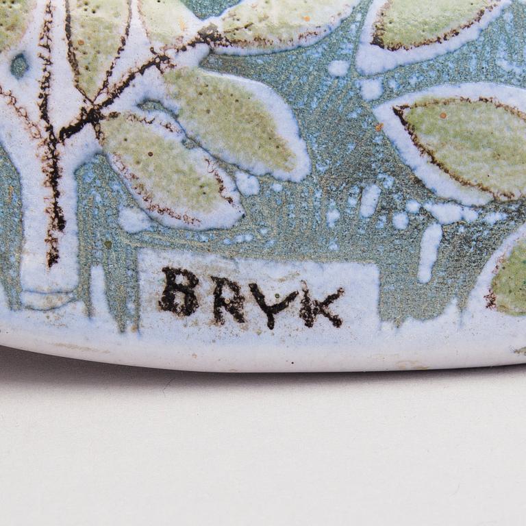 A ceramic plate signed Bryk Arabia.