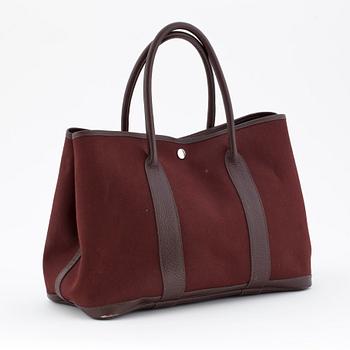 HERMÈS, a brown canvas and leather bag, "Garden Party".