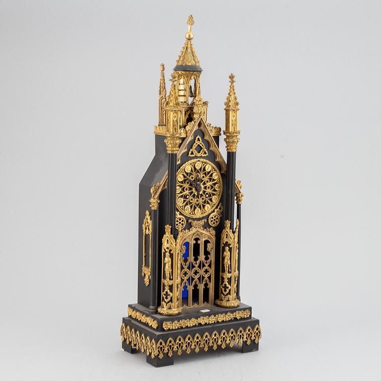 A gothic revival mantel clock.
