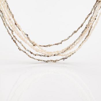 A six-strand pearlcollier with cultured pearls and a metal clasp.