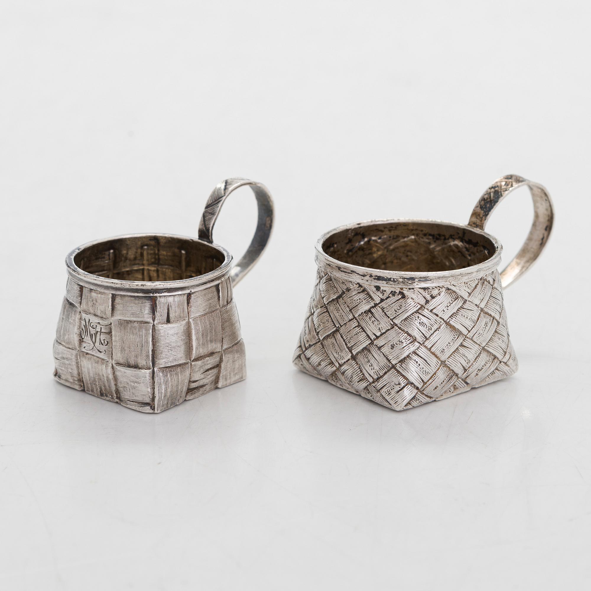 A silver and glass bottle with eight silver charka, maker marks of Pyotr Yermolajevich Davidov, Saint Petersburg, 1884.