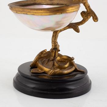 A gilt-bronze and mother of pearl stand for a pocket watch, later part 19th century.