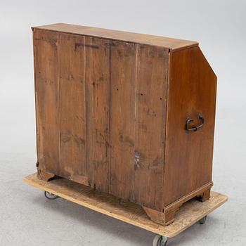 An oak secretaire, around 1800.