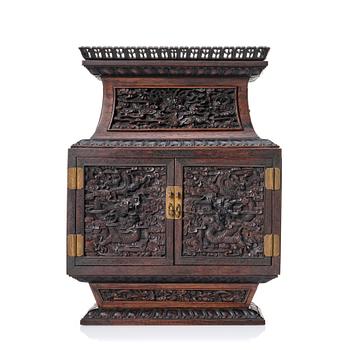 873. A hardwood dragon cabinet, Qing dynasty 18/19th Century.