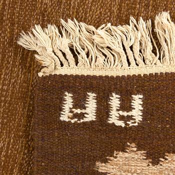 A signed Swedish flatweave carpet ca 207 x 137 cm.