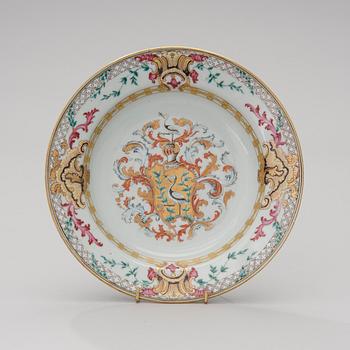 A CHINESE SOUP PLATE, amorial procelain. Qing dynasty, Qianlong (1736-95).