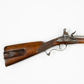 A 18th Century flintlock rifle.