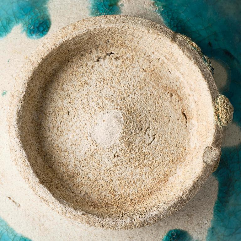 A Kashan Turquoise glazed conical pottery bowl, central Persia, 13th century.