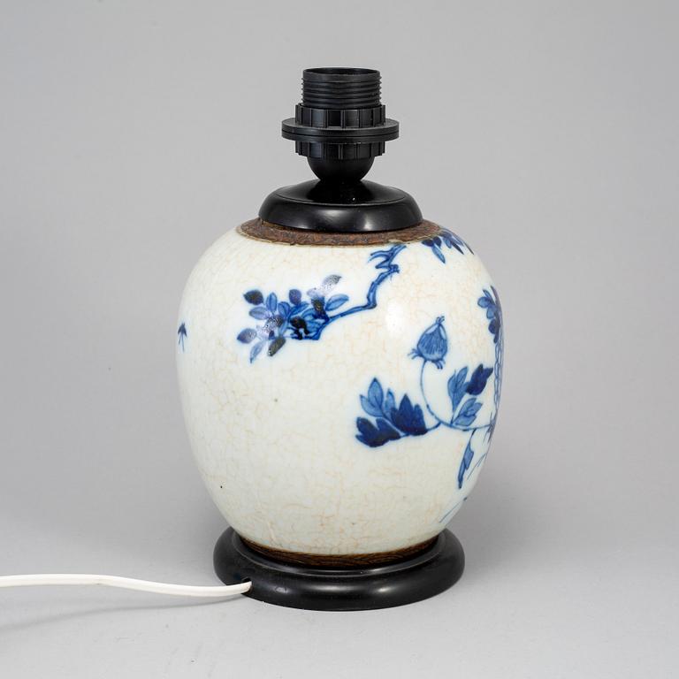 A blue and white jar made in to a lamp, China, early 20th Century.