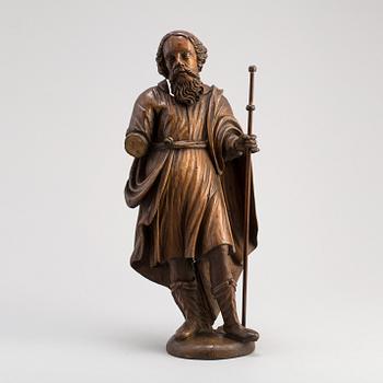 A 17TH CENTURY CARVED WOOD SCULPTURE OF A SAINT.