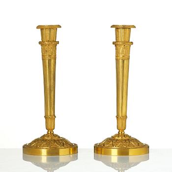 A pair of Empire ormolu candlesticks.