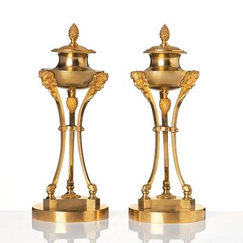 A pair of Empire tripod shaped casolettes.