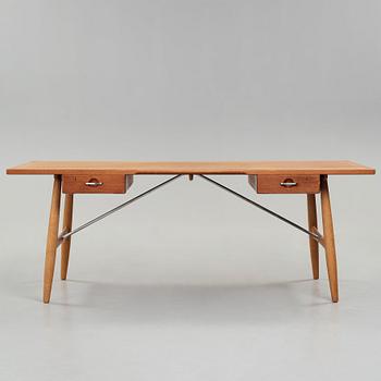 Hans J. Wegner, skrivbord, teak och ek med stålstag, "JH 571", Johannes Hansen, Danmark 1950-60-tal.