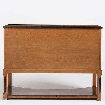 Carl Bergsten, an oak veneered sideboard/ chest of drawers, Nordiska Kompaniet Sweden 1923. Part of a set exhibited in Gothenburg 1923.