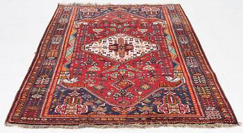 An oriental rug, c. 218 x 133 cm.