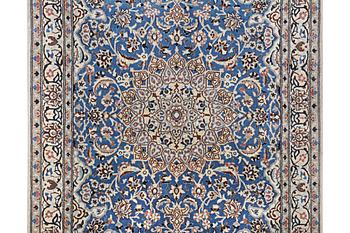 A Nain rug, part silk, 9 laa, c. 190 x 118 cm.
