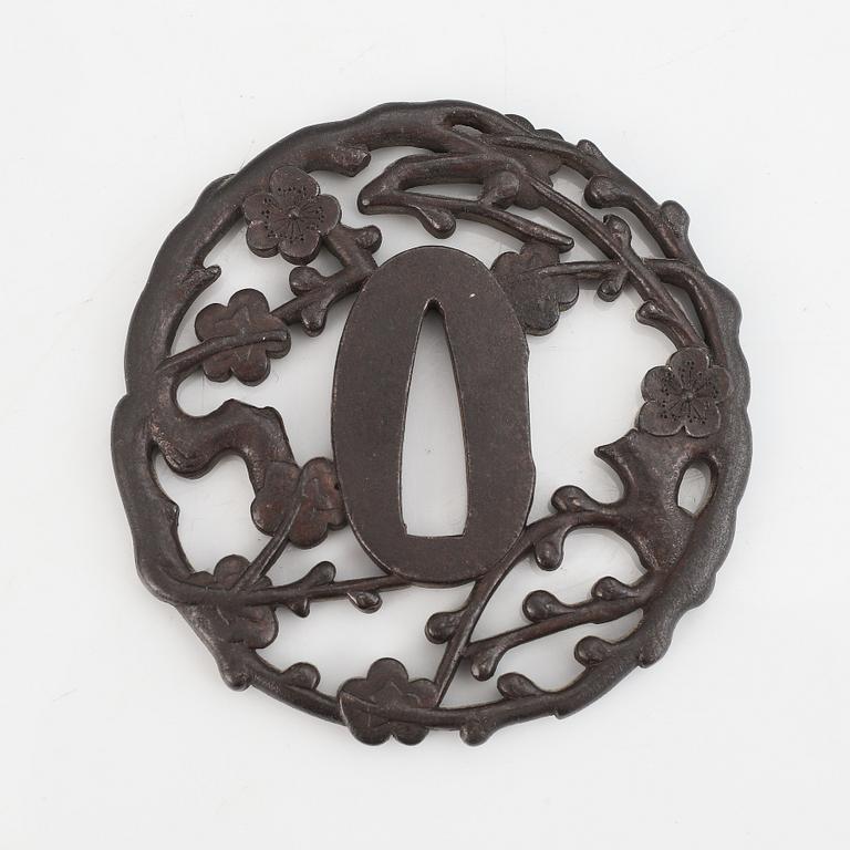 A signed iron tsuba, 18th Century.