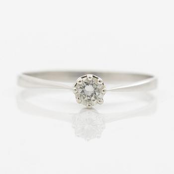 Ring with a brilliant-cut diamond.