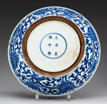 A large blue and white charger, Qing dynasty, with Kangxis six character mark and period (1662-1722).