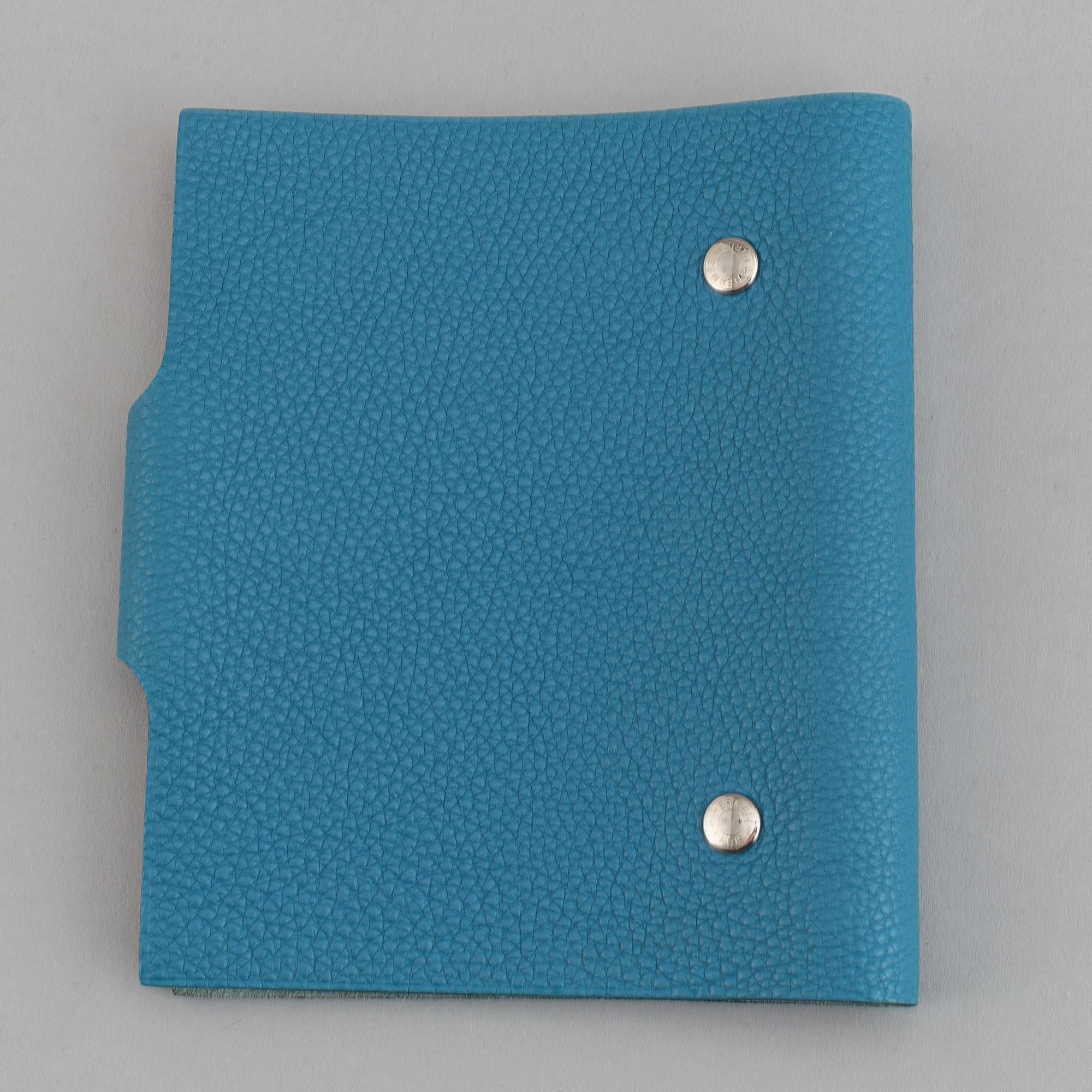 Hermès, a blue leather notebook with two scripple pads.