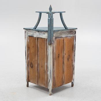 A painted corner cabinet, late 19th century.