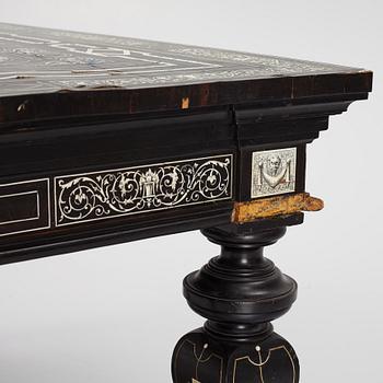 A Renaissance-style ebony, ebonized and ivory-inlaid library table, late 19th century, presumably Germany.