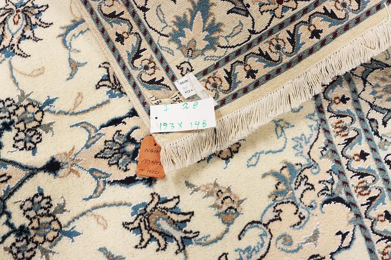 A Nain part silk rug, c. 193 x 148 cm.