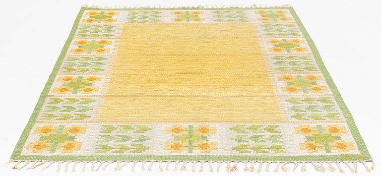 Berit Woelfer, a flat weave carpet, signed BW, ca 235 x 165 cm.