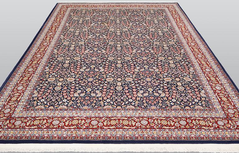 A signed Hereke carpet, ca 340 x 246 cm.