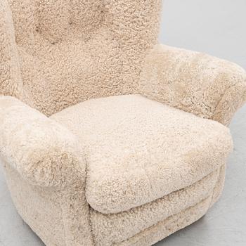 A sheepskin upholstered lounge chair.