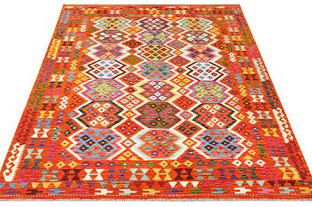 An Afghan kilim rug, c. 290 x 203 cm.