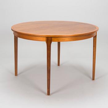 A 1960s teak and oak dining table.
