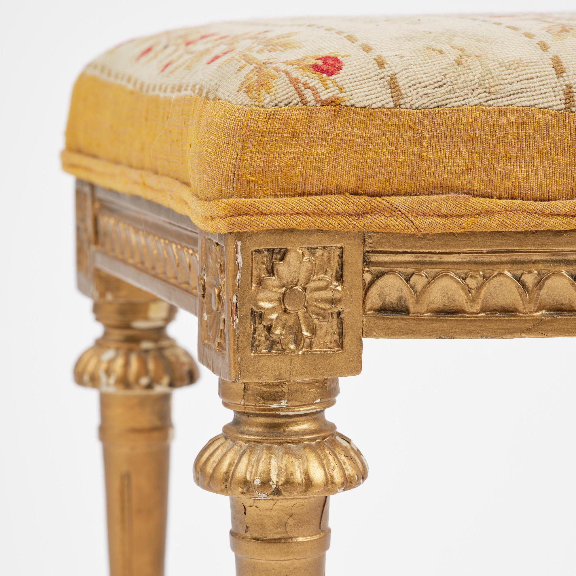 A pair of giltwood stools by E. Ståhl (master in Stockholm 1794-1820).