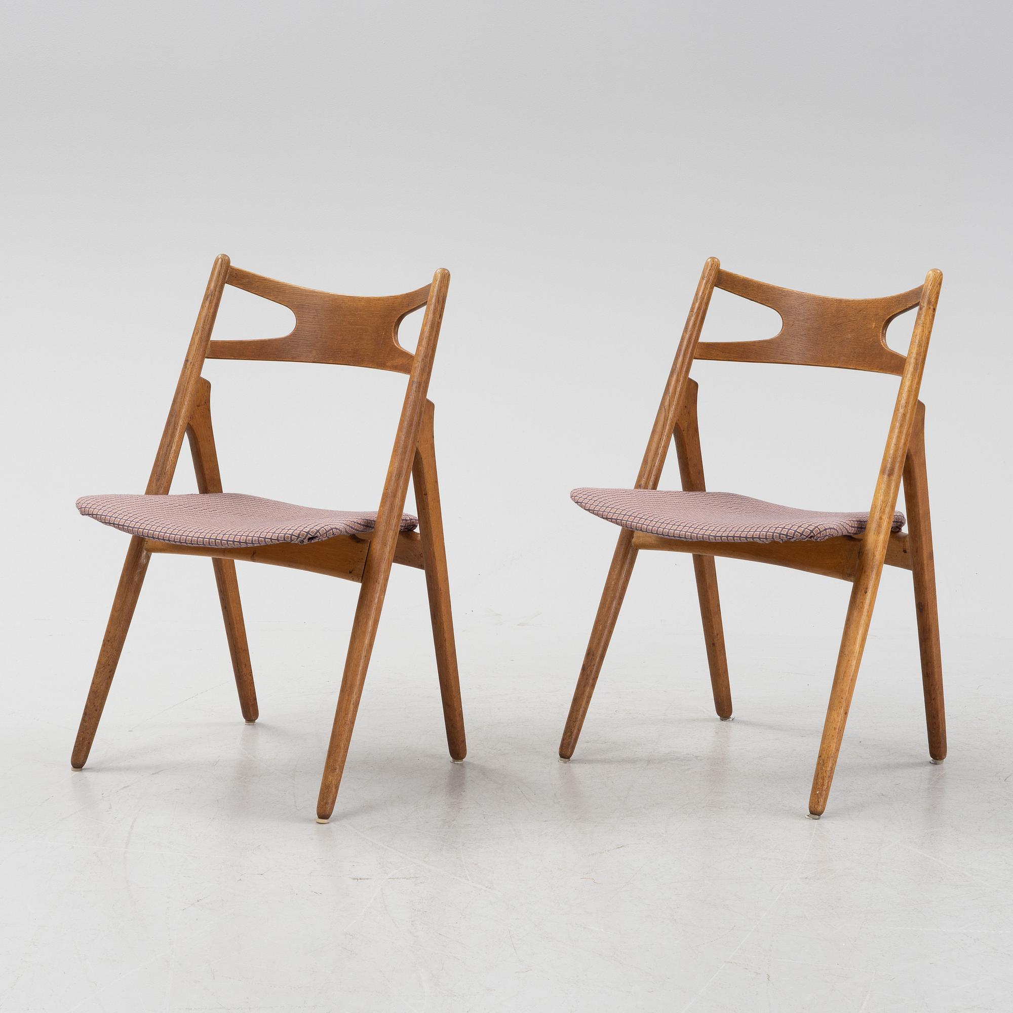 A set of six model CH 29 'Savbukstolen' by Hans J Wegner, designed 1952.