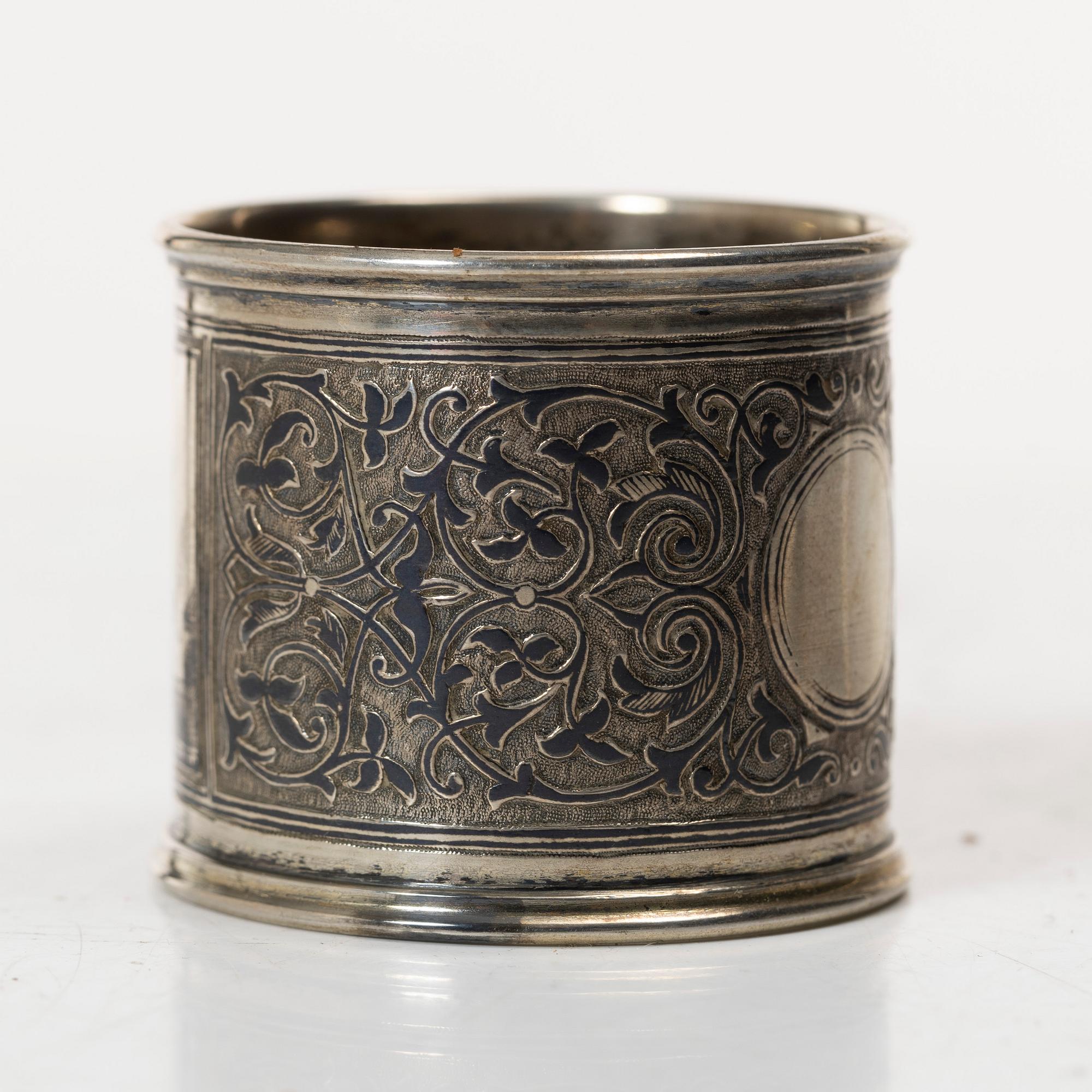 A Russian silver niello napkin ring and spoon, late 19th century-early 20th century.