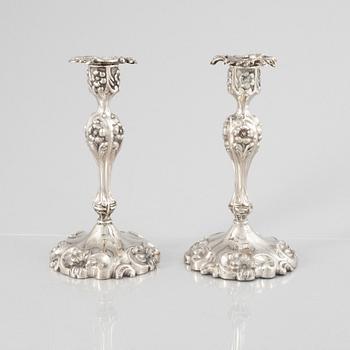 A Pair of Swedish Rococo Revival Silver Candlesticks, mark of Gustaf Möllenborg, Stockholm 1865.