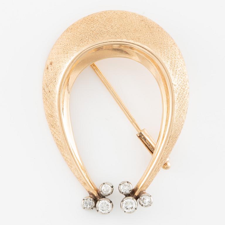 Brosch 14K guld med runda briljantslipade diamanter.