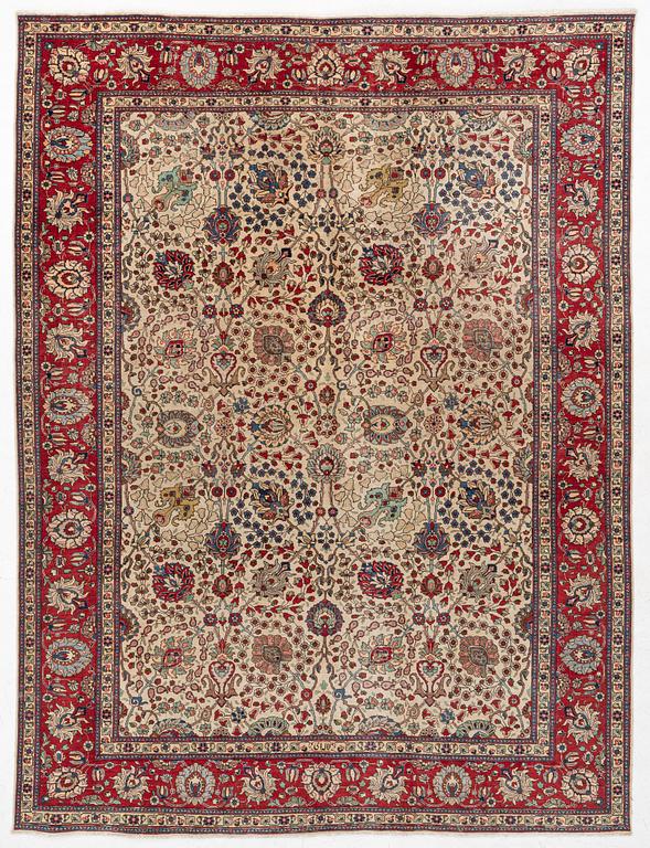 A Tabriz carpet, c. 385 x 287 cm.