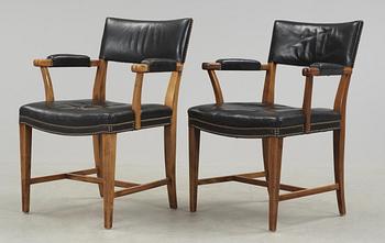 334. A pair of Josef Frank walnut and black leather armchairs, Svenskt Tenn, model 695.