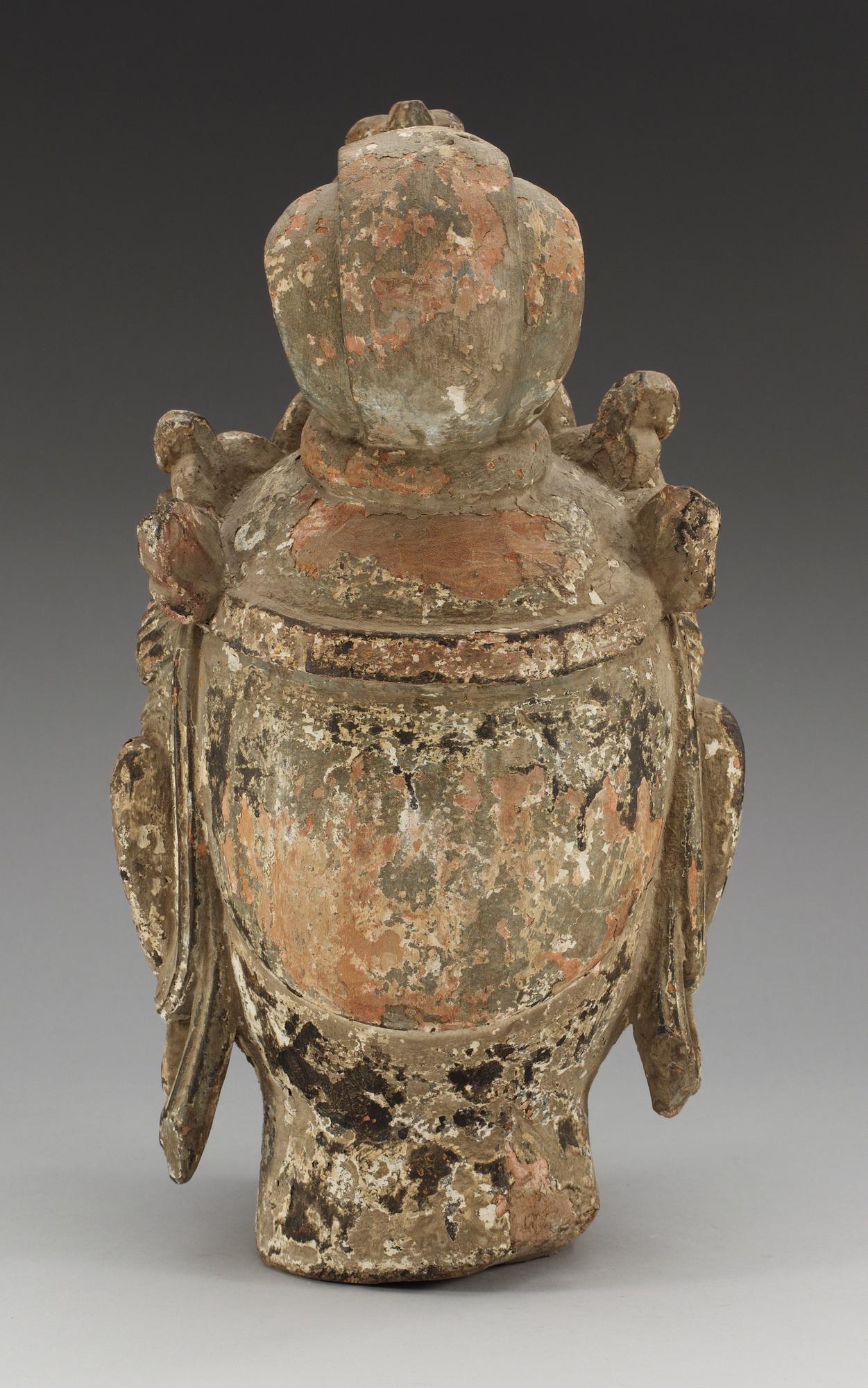 A Yuan/Ming style sculptured and painted wood head of Bodhisattva Guanyin, possibly Ming dynasty (1368-1644).