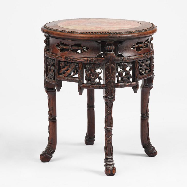 A Chinese hardwood table with a marble top, late Qing dynasty.