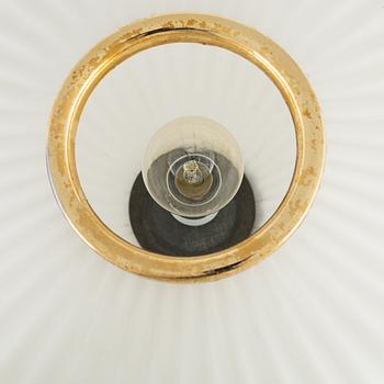 A glass and metal table lamp, probably Italy, 1960s.