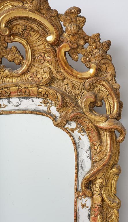 A rococo giltwood mirror attributed to N. Meunier (master in Stockholm 1754-97).