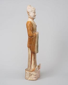 A potted, partially glazed tomb figure of a guardien, Tang dynasty (618-907).