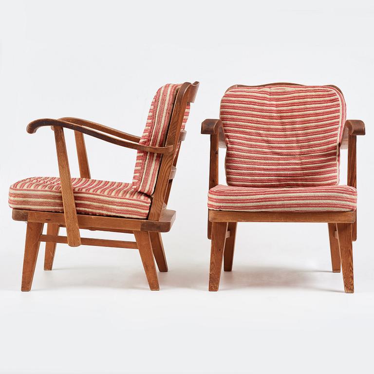 Nordiska Kompaniet, a pair of "sportstugemöbler" stained pine easy chairs, Sweden 1930-40's.