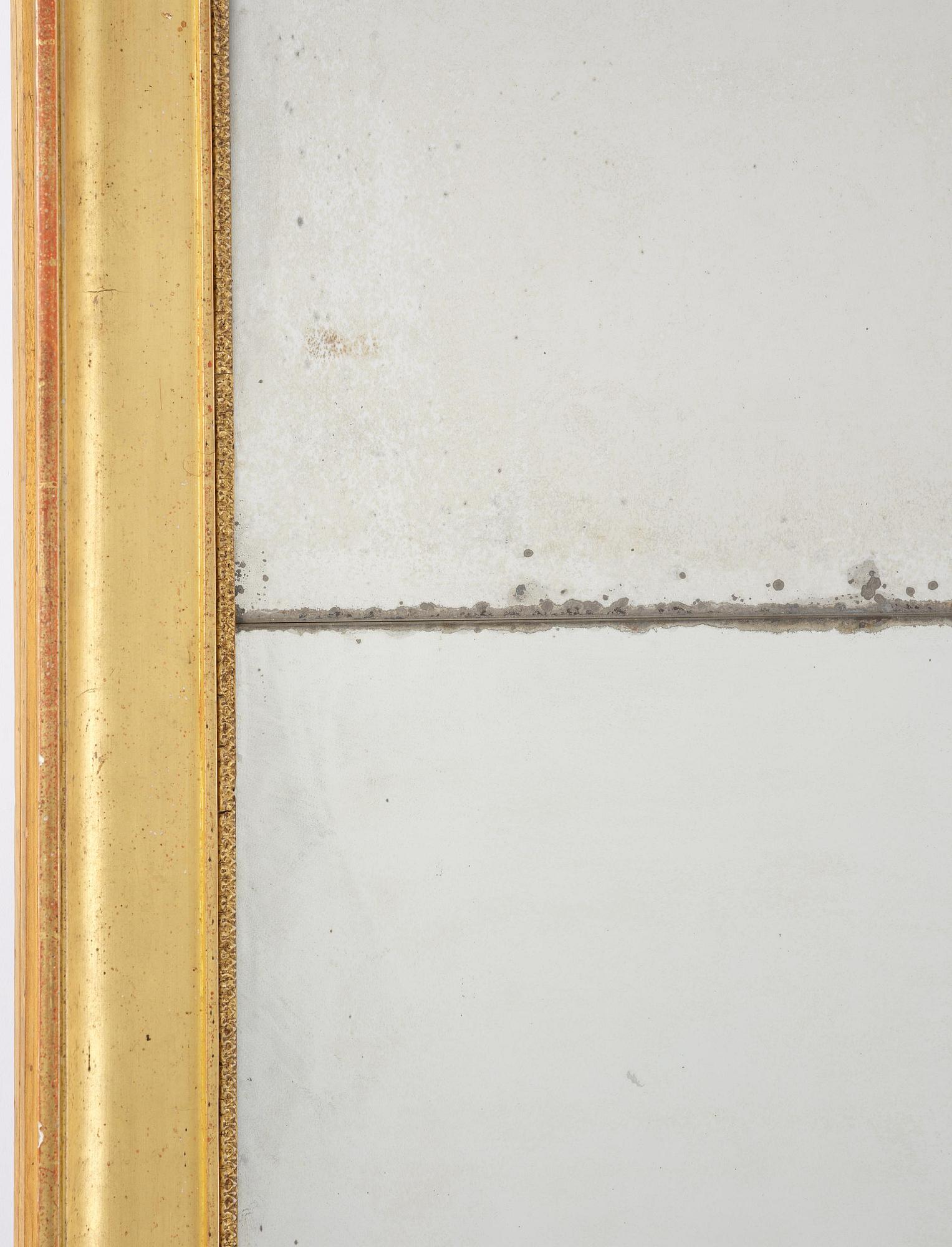 A Swedish giltwood Empire mirror, first part 19th century.